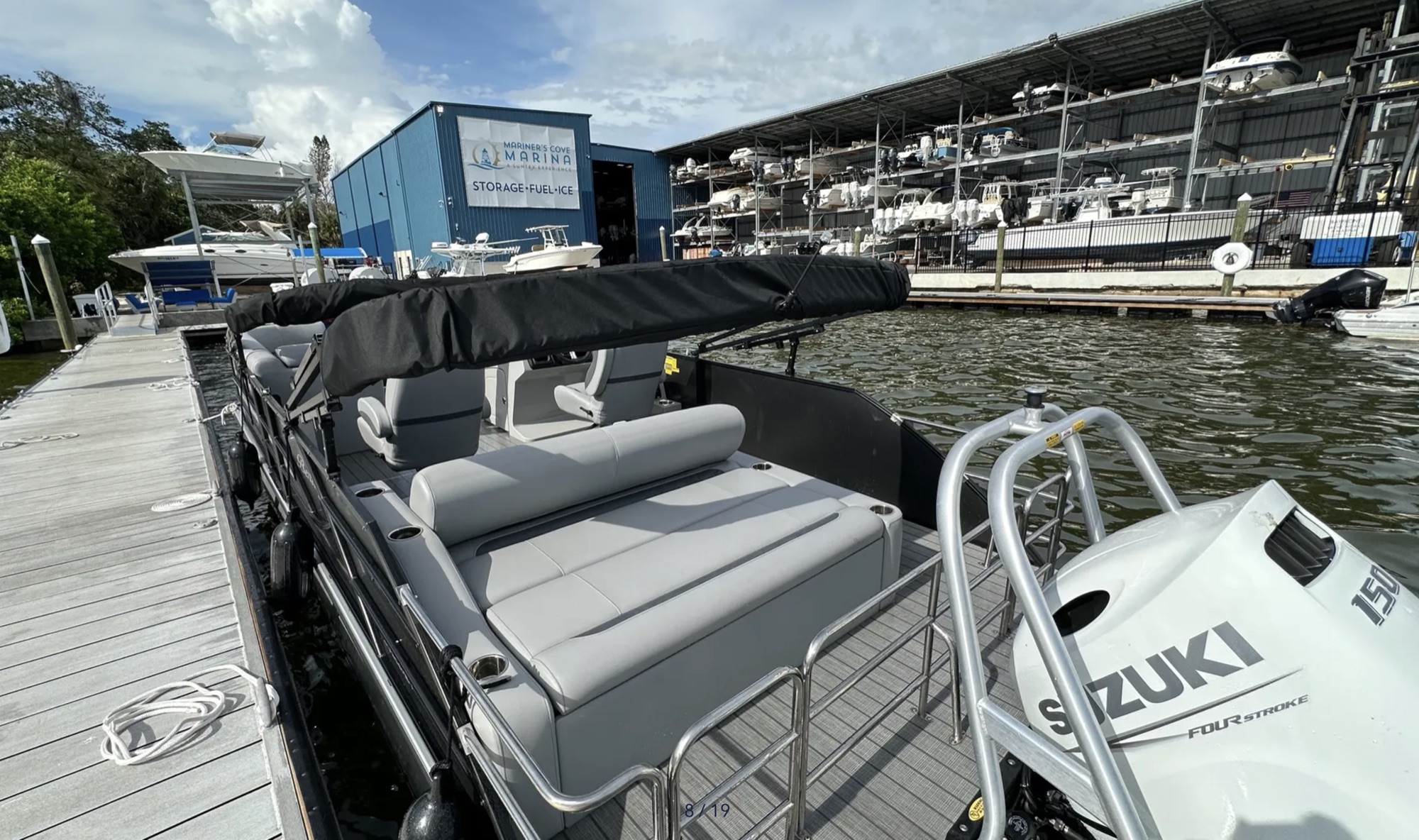 Rear swingback seating and Suzuki motor at Mariner’s Cove Marina