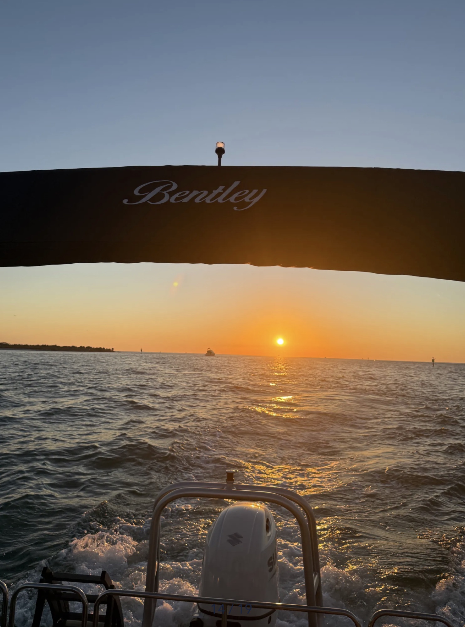 Sunset cruise viewed beneath the Bentley bimini