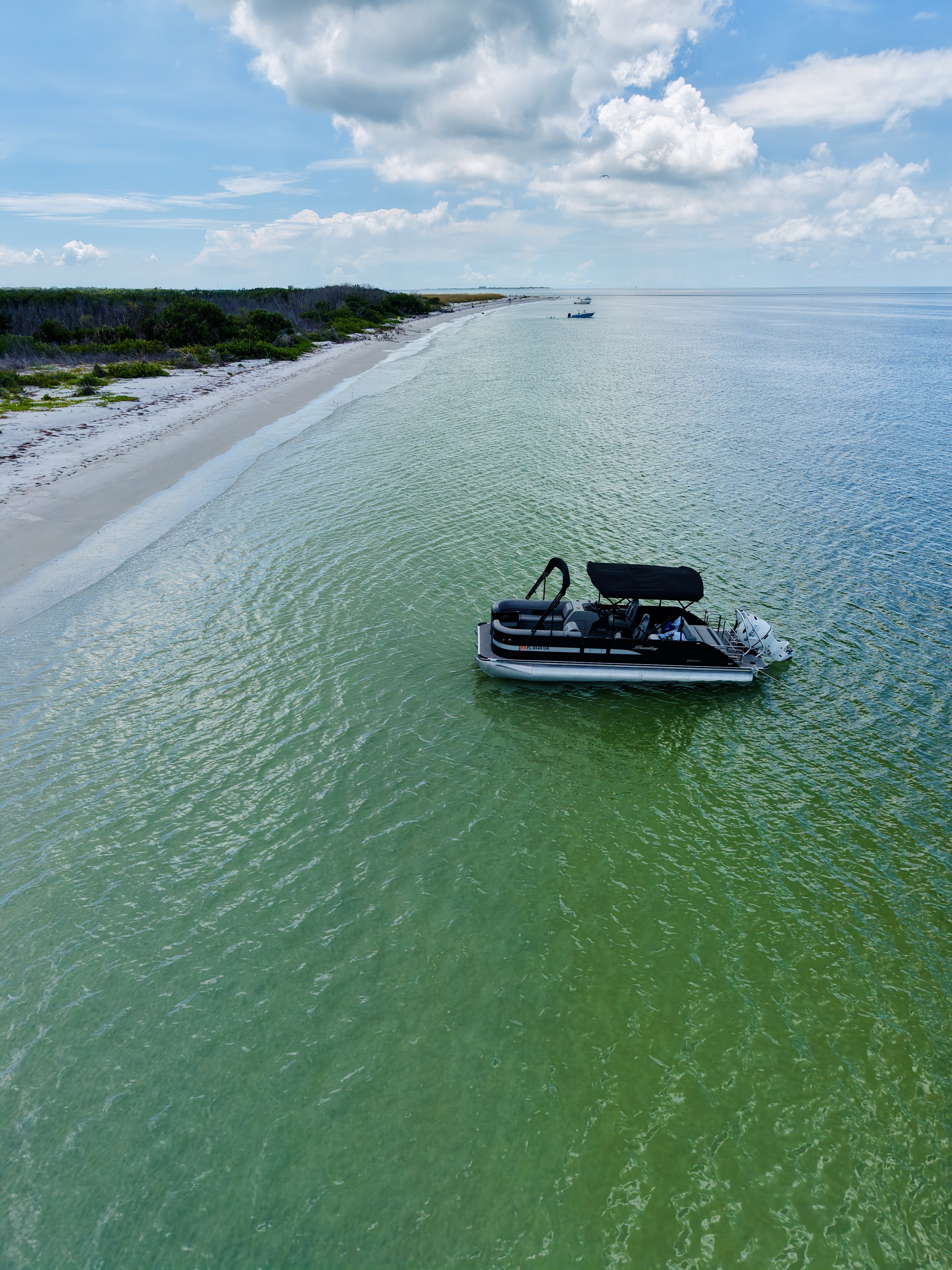 Aerial view of the Bentley tritoon beside the Gulf shoreline